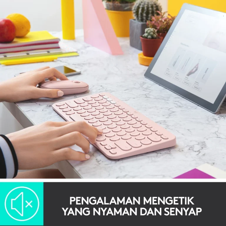 Tampilan Logitech K380 Multi-Device Keyboard di atas meja kerja, terhubung dengan laptop, tablet, dan smartphone melalui koneksi Bluetooth.