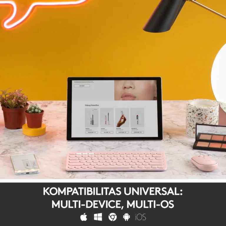 Tampilan Logitech K380 Multi-Device Keyboard di atas meja kerja, terhubung dengan laptop, tablet, dan smartphone melalui koneksi Bluetooth.